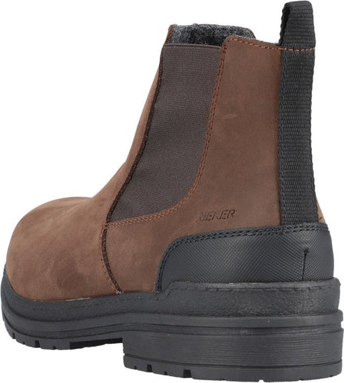 Close up of a brown leather Chelsea boot with black sole, side elastic goring, and heel pull tab.