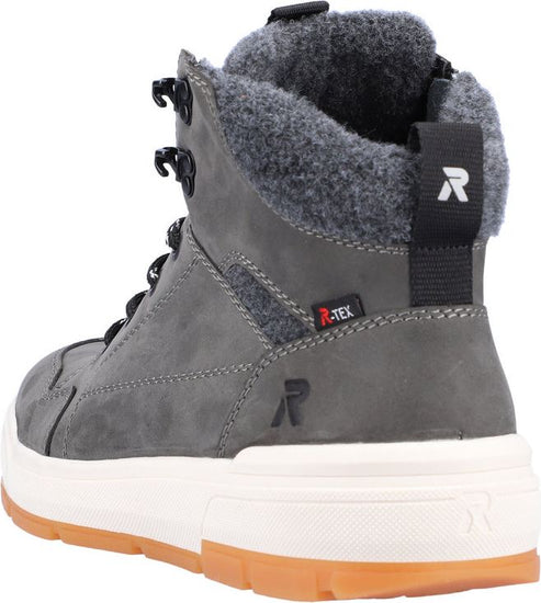 Grey high-top shoe with a white and tan sole, black laces and metallic eyelets, a grey fuzzy interior lining, and an R-TEX logo.