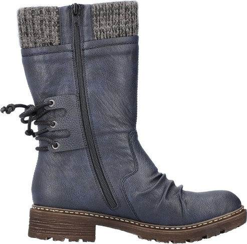 A blue mid-calf boot features a knit ankle cuff, side zipper, ruched vamp, lace-up back and lug sole.