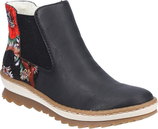 Black ankle boot with floral fabric at the heel and elastic panels.
