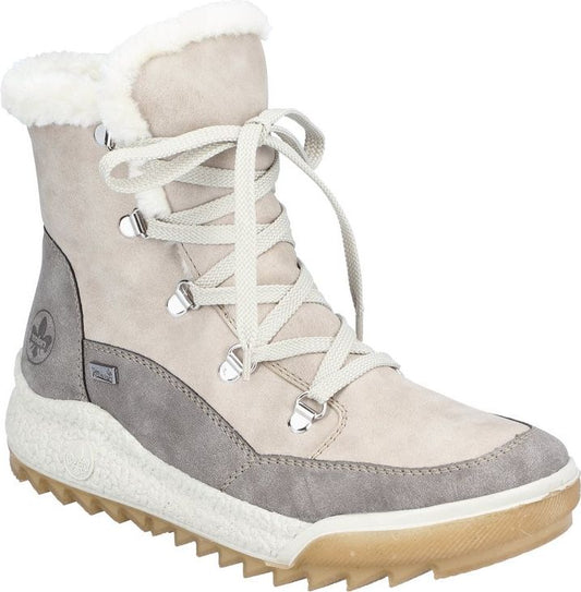 Ankle-high beige suede boot with white faux fur trim, lace-up closure, gray suede accents at the heel and sole.