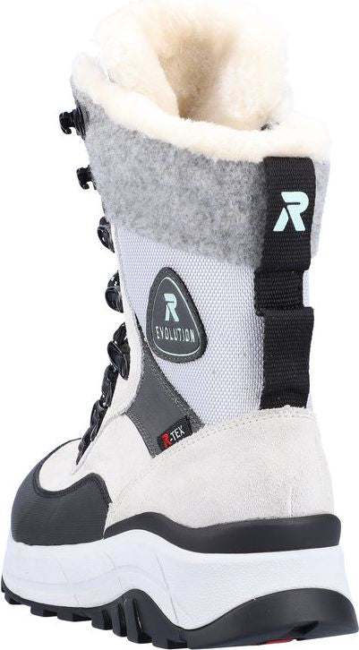 White and grey high-top lace up boot with black accents, "REVOLUTION" and "R-TEX" logo on the side, and fur trim.