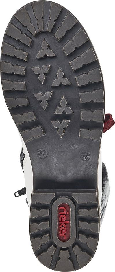 Sole of a boot showing a deep tread pattern and the visible text 'Rieker'.
