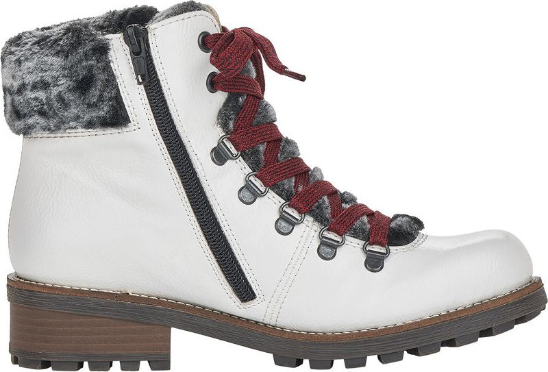 White ankle boot with faux fur trim, lug sole, side zipper, and red laces.