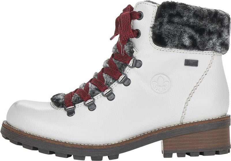 White ankle boot with red laces, dark grey fur trim, and lug sole.