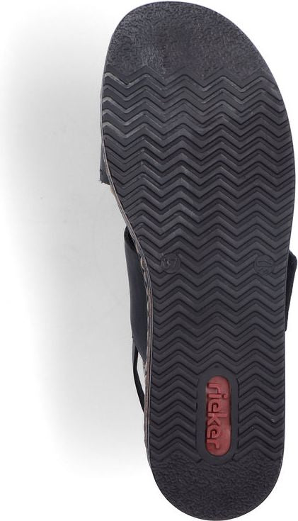 Black sandal with chevron patterned sole; red label visible in sole.