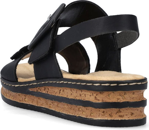 Black platform sandal with adjustable straps and cork sole.