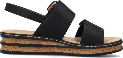 A black sandal with a cork sole.