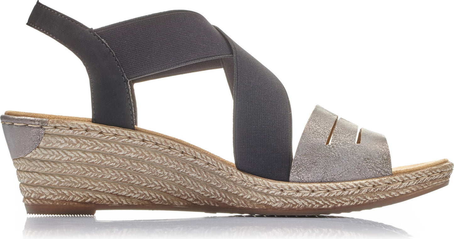 Gray wedge heel sandal with elastic straps and metallic toe band.