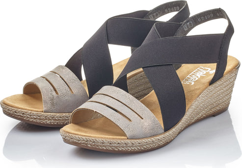 Wedge heel sandals featuring elastic black and grey straps.