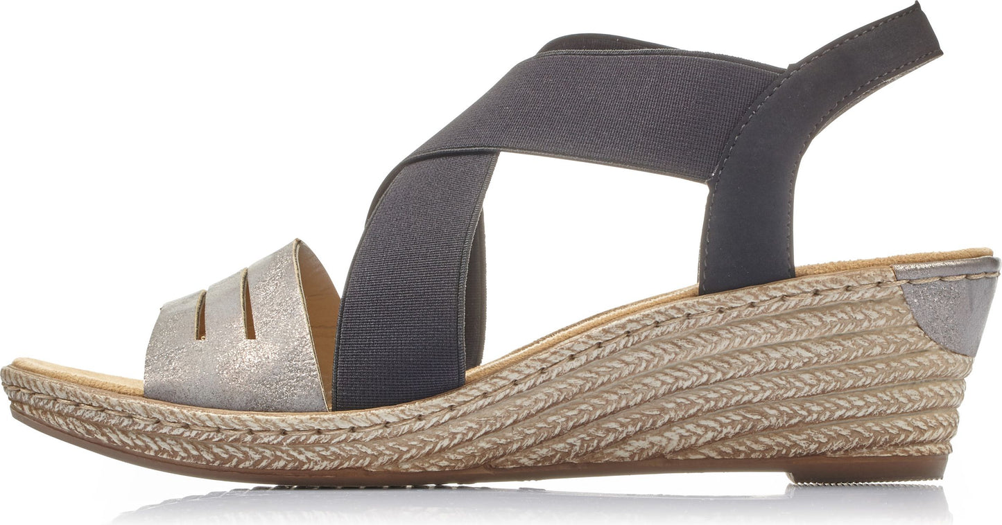 Womens wedge sandal with light gold toe, woven rope design wedge heel, and crossed elastic straps.