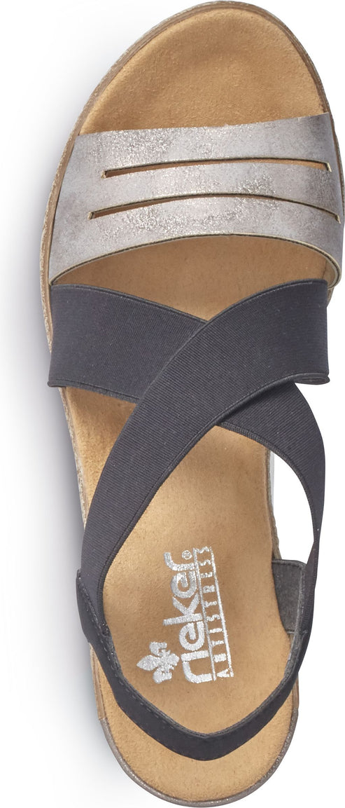 A top-down view of a sandal with a silver, multi-slit toe strap, a diagonally crossed elastic strap, and an ankle strap.