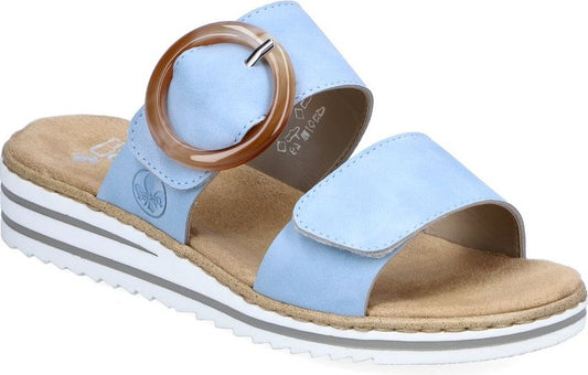 Light blue slide sandal with a large circular buckle.