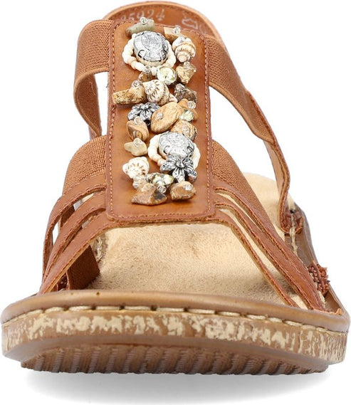 Brown sandal featuring seashell decorations on the front strap.