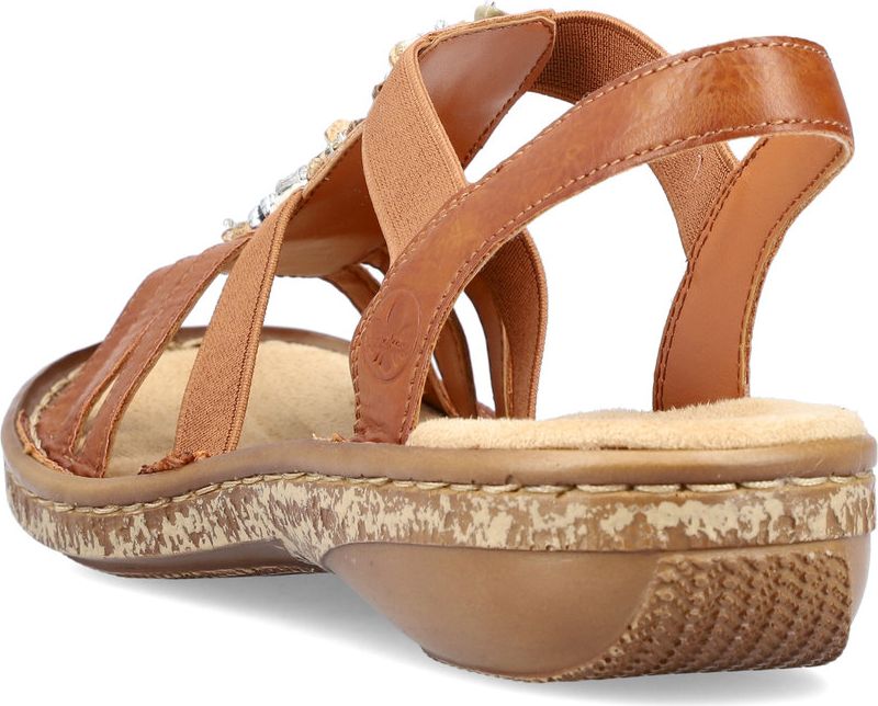 Tan-colored sandal with elastic straps, beaded embellishments, and a low heel.