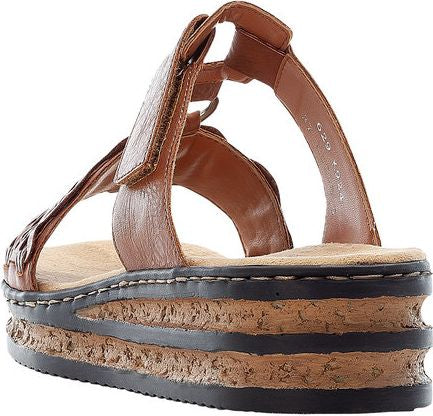 Brown leather platform sandal with adjustable velcro straps.