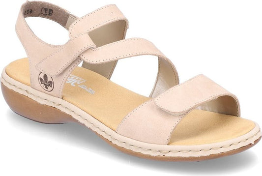 Beige sandal with adjustable straps and a low heel.