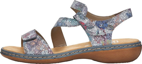 A floral pattern sandal with three straps and velcro closures.