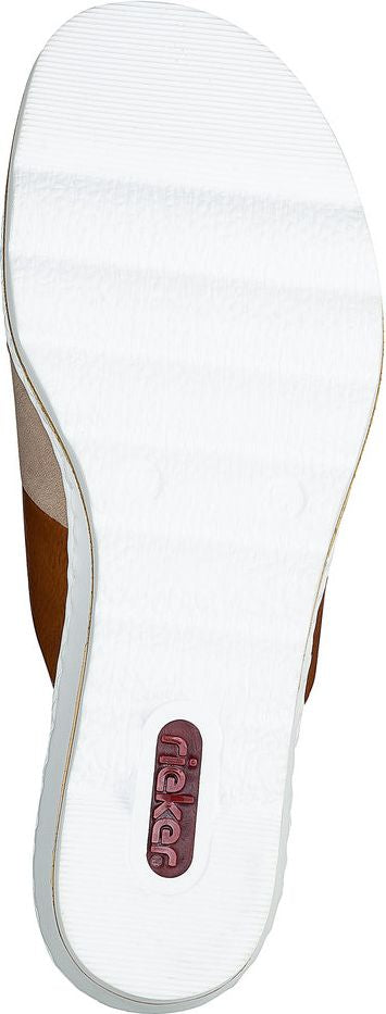 Bottom view of a white sandal, with the word 'Ricker' written on the footbed.