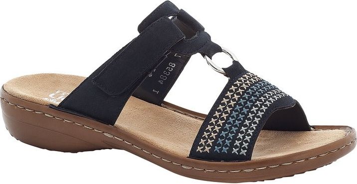 A dark blue sandal with an adjustable hook-and-loop strap, decorative metal rings, and cross-stitch pattern detailing, featuring a contoured footbed and low wedge heel.