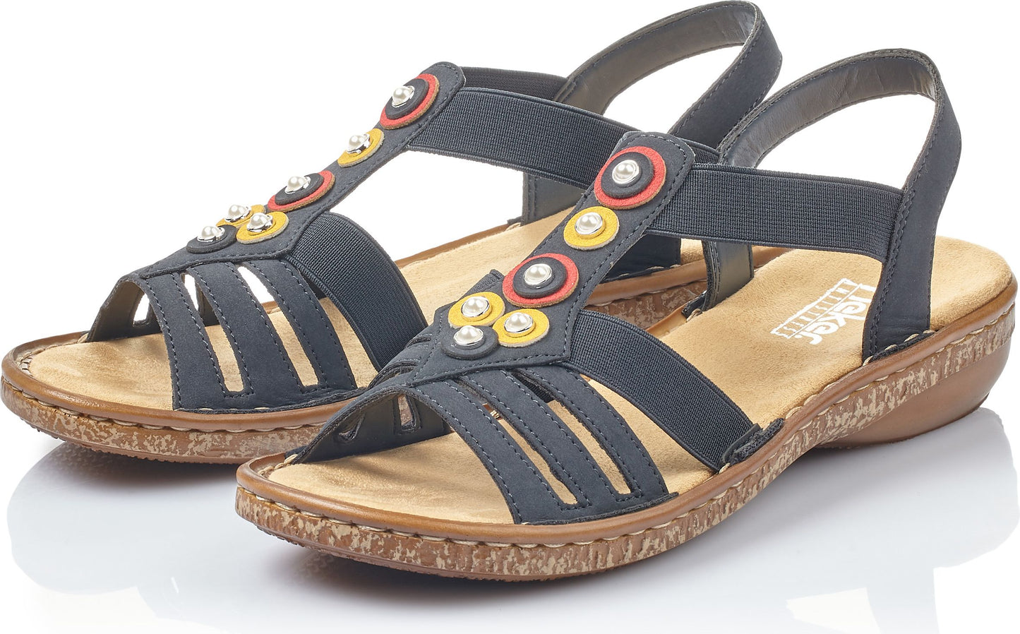 Black strappy sandals with elastic straps and colorful circle embellishments.