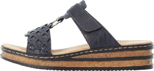 A side view of a navy blue sandal with a cork wedge heel and a hook-and-loop fastener strap.