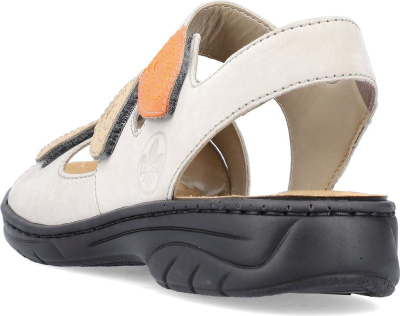 Low back white sandal with two beige and orange adjustable velcro straps and black sole.