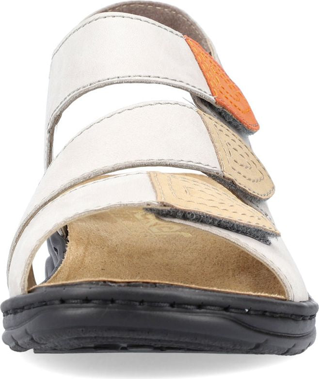 Front view of white sandal with adjustable straps and black sole.