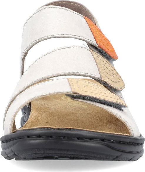 Front view of white sandal with adjustable straps and black sole.