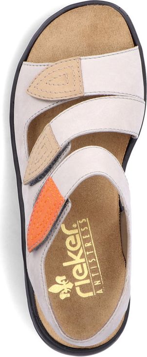 A sandal with white straps and beige and orange accents.