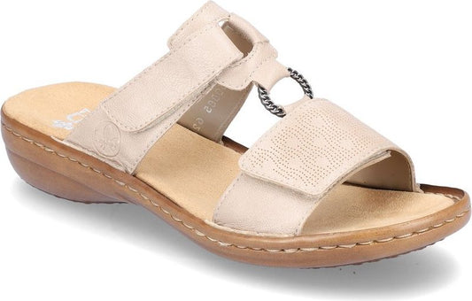Beige sandal slide with adjustable velcro straps and a decorative ring detail.