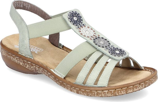 Light green sandal with decorative beaded straps and a low wedge heel.