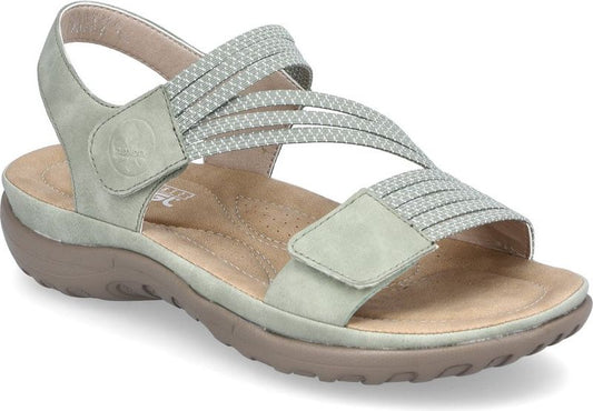 Light green sandal with multiple crisscrossing elastic straps and velcro closures.