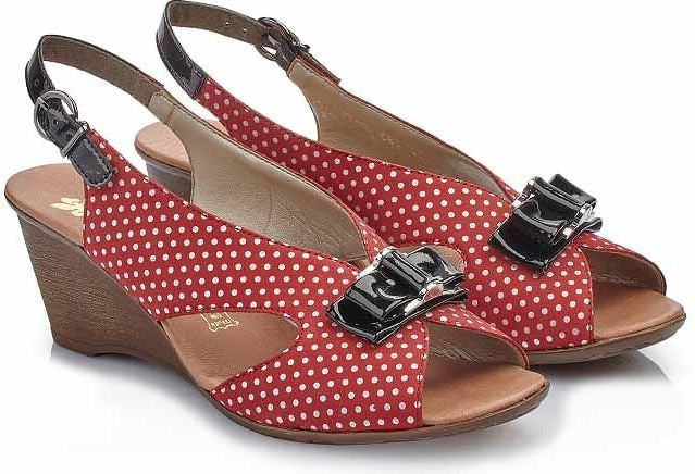 Red and white polka-dotted peep-toe wedge sandals with slingback straps and shiny black bow details.