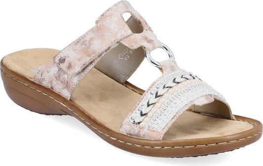 A sandal with light brown sole, beige insole, and two straps with circle hardware and stitch details.