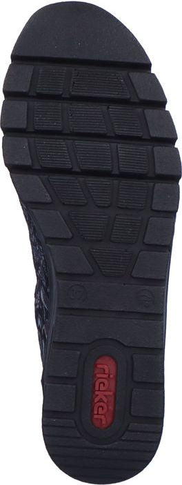 A shoe sole with deep treads and visible text 'Rieker' in red.