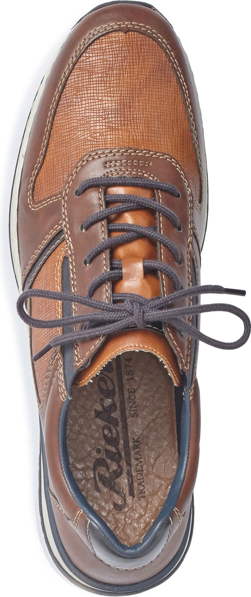 A brown leather and textile sneaker with blue laces.