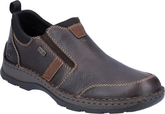 Brown slip-on shoe with dark sole, visible stitching, and brown accents.