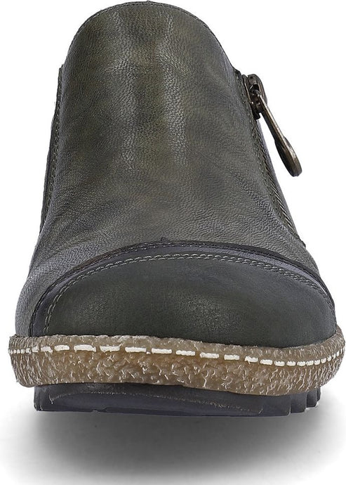 Green leather ankle boot with zipper and chunky sole.