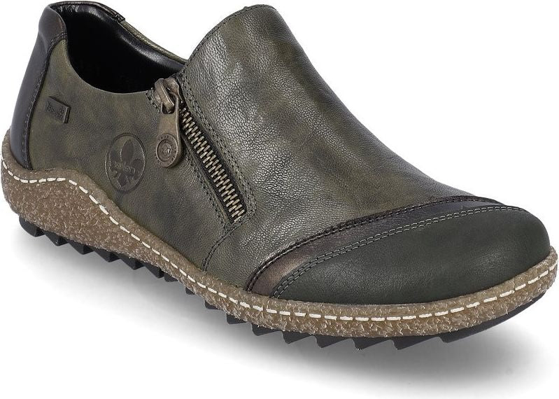 Green slip-on shoe with side zipper and decorative stitching.