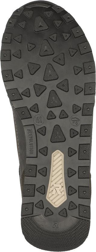 The outsole of a shoe featuring triangular and square treads and a logo.
