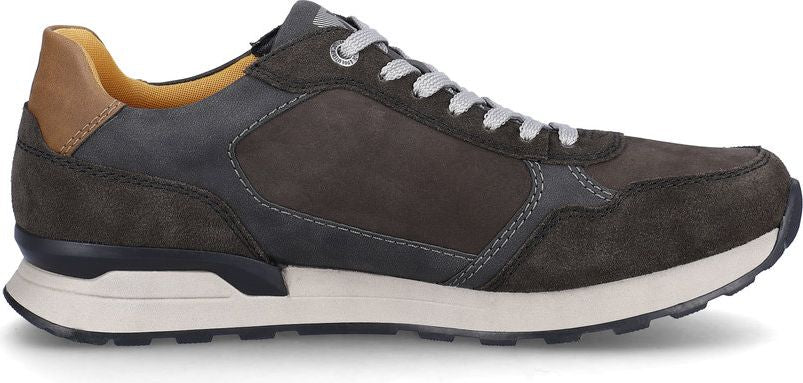 A gray leather sneaker with white laces and a brown heel.