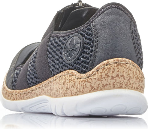 Low-profile black shoe with a cork midsole and a white outsole, featuring a breathable mesh upper.