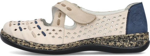 Beige Mary Jane shoe with geometric cutouts and an adjustable strap.