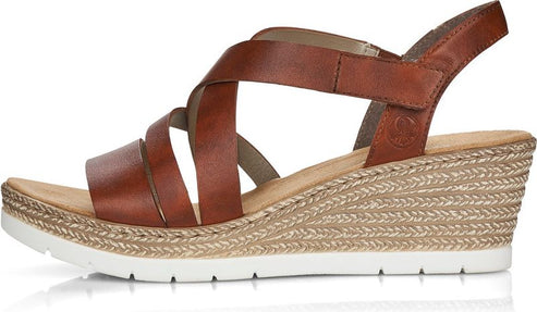 Brown wedge sandal with criss-cross straps and white sole.