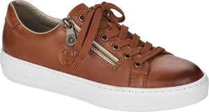 Brown sneaker with white sole, laces, and side zipper.
