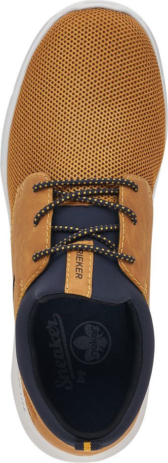 A tan shoe with black and white patterned laces, and a navy blue inner lining.