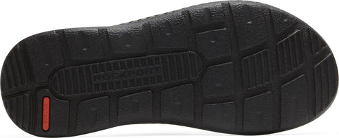 A black shoe sole with grip patterns and a visible red logo.