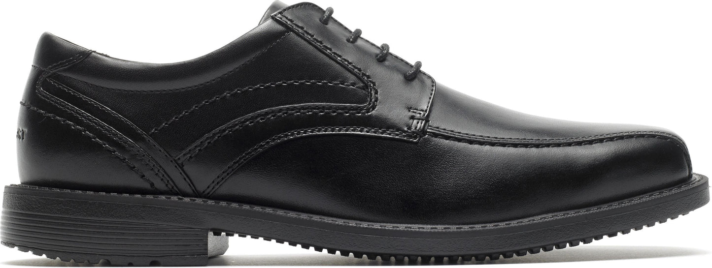 A black dress shoe with laces and a low heel.