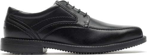 A black dress shoe with laces and a low heel.